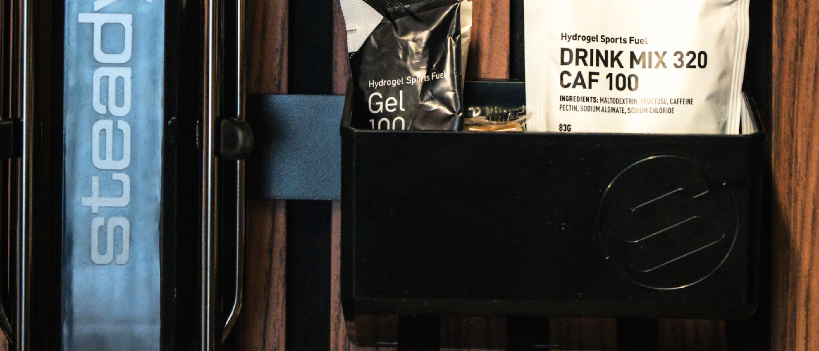 Hydrogels being stored in a black bin compartment with a Steadrack logo. 